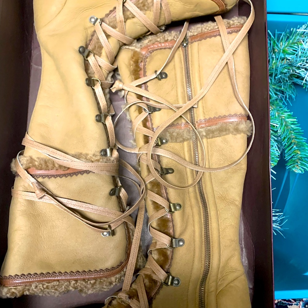 Cole Haan lace up boots.